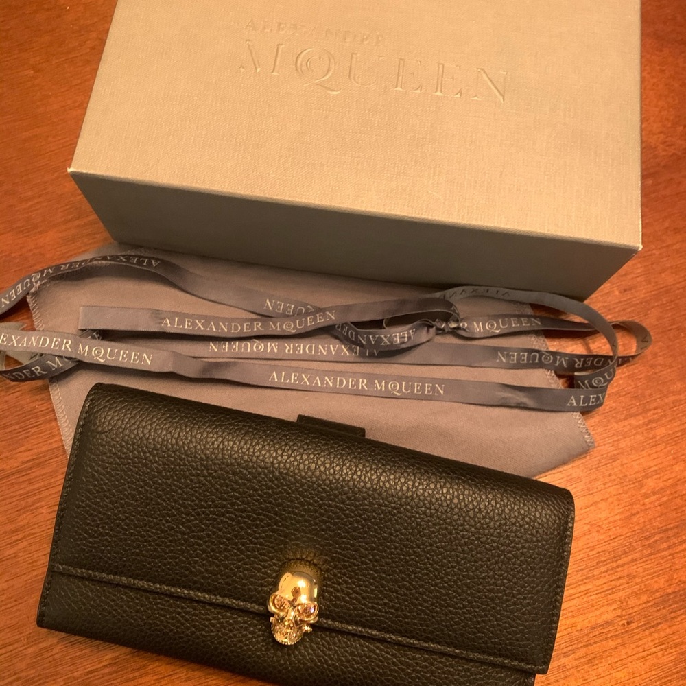 Alexander McQueen pebbled leather skull wallet.